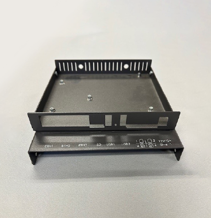 Compact custom desktop electronic enclosure designed for benchtop and laboratory applications, featuring a clean front panel and sturdy formed metal construction